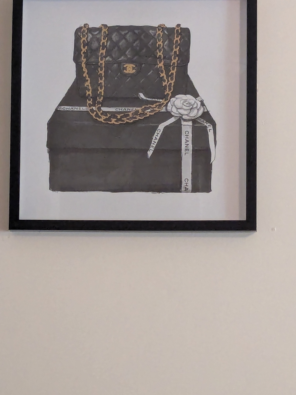 Black Quilted Handbag Wall Art with Gold Chain Accents